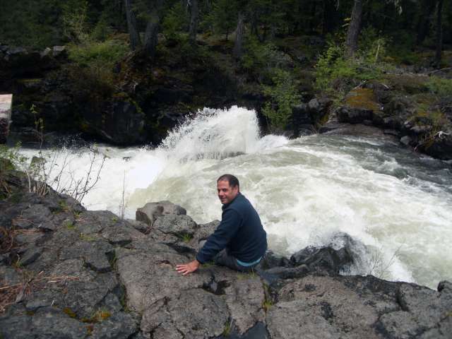 Dan Shaw sitting at the edge of an Oregon gorge