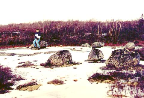 Another angle, with a person sitting on a stone